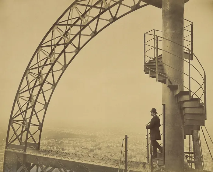 Framed Print : Man standing on the scientific tower of the Eiffel Tower in 1889