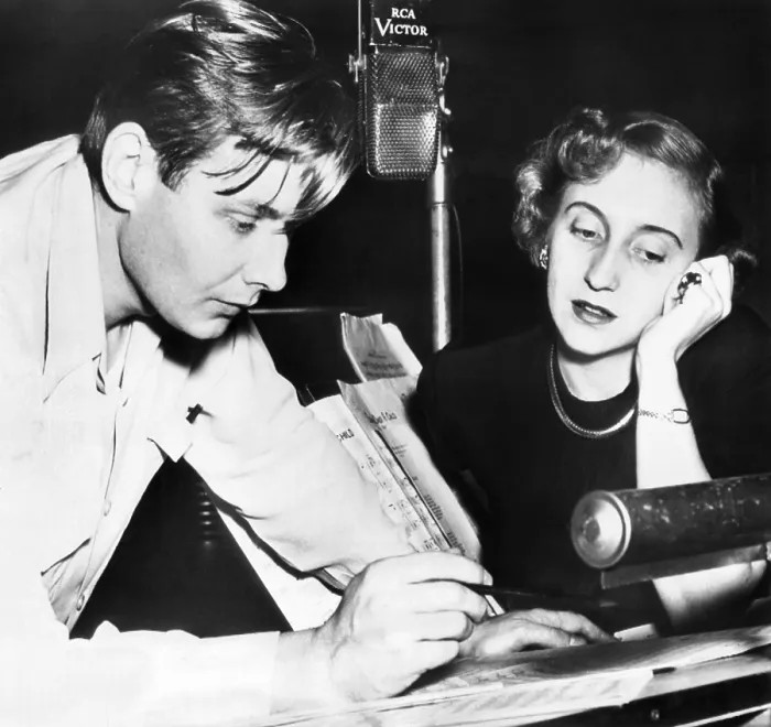 Framed Print : Margaret Truman, singing daughter of the President, recording her first album. With her director, Robert Shaw, she reviews music in the RCA recording studio. Nov. 10, 1950