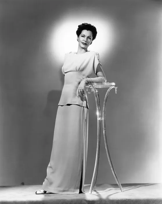 Framed Print : Maria Montez, modeling a pink crepe dinner dress, 1944 Framed Print : Maria Montez, modeling a pink crepe dinner dress, 1944