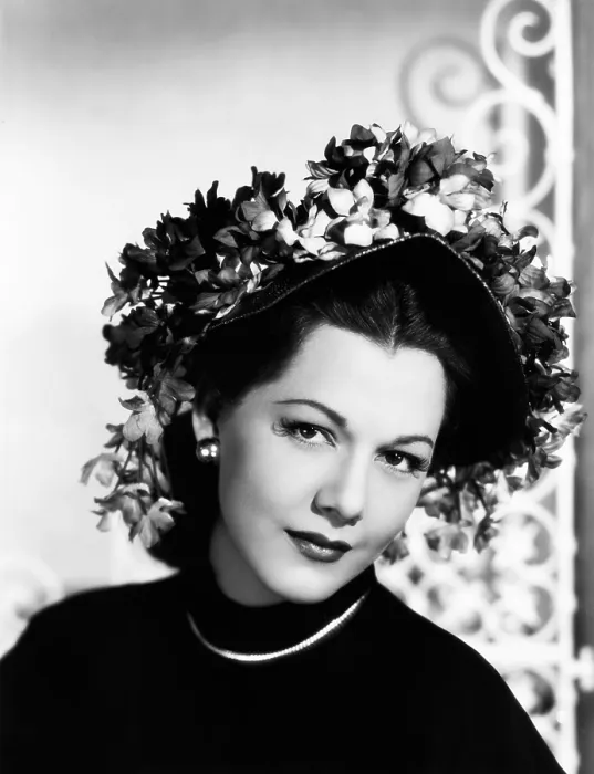 Framed Print : Maria Montez, modeling a violet-colored straw bonnet trimmed with violets, 1946