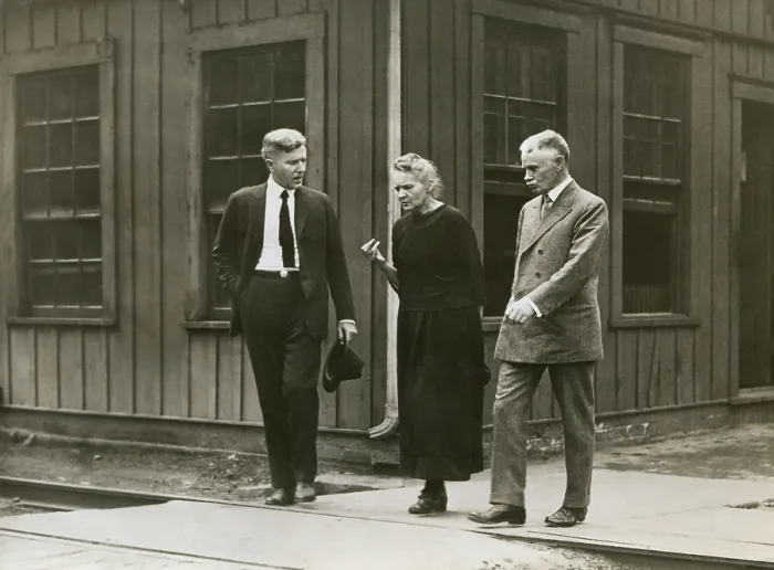 Framed Print : Marie Curie walking with fellow scientists at radium refinery plant in Pittsburgh, PA, 1921. (BSLOC_2018_4_102)