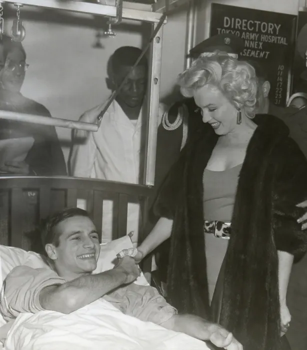 Framed Print : Marilyn Monroe visiting a wounded soldier in a hospital in Japan. Ca. Feb. 18-22, 1954. (BSLOC_2014_13_205)