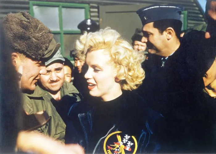 Framed Print : Marilyn Monroe wearing a jacket with the mosquito patch of the 6147th Tactical Control Group. Ca. Feb. 18-22, 1954. (BSLOC_2014_13_209)