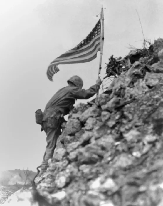 Framed Print : Marine 1st Battalion commander braved sniper fire to place a flag on Shuri Castle, Okinawa. May 30, 1945. The same flag was first raised over Cape Gloucester and then Peleliu