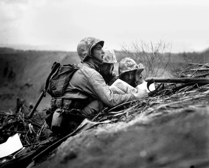 Framed Print : Marine observer finds the location of a machine gun nest on a map of Iwo Jima. With this information the artillery or mortars would target the position. Between Feb. 19-28, 1945