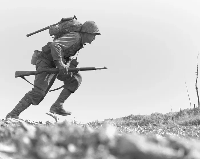 Framed Print : Marine Pfc. Paul E. Ison runs through Japanese machine gun fire on Okinawa, May 10, 1945. Ison and the rest of his unit made the dash unwounded
