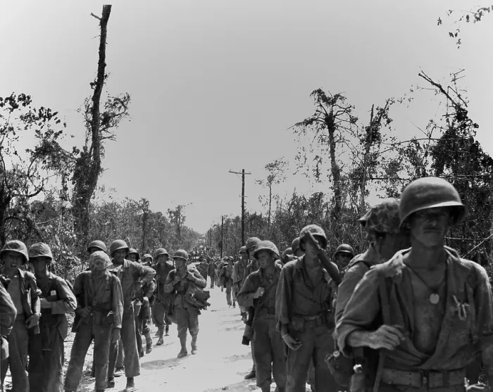 Framed Print : Marines advancing on a road toward the northern end of Peleliu Island. Sept.-Nov. 1944. World War 2, Pacific Ocean. (BSLOC_2013_13_26)