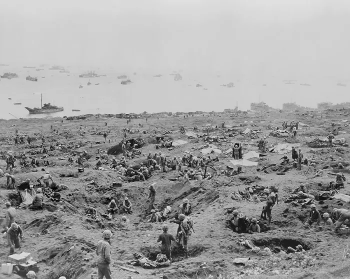 Framed Print : Marines in foxholes on the southeast edge of Motoyama Airfield #1, Iwo Jima. Landing craft are beached on right. February 23, 1945. World War 2. (BSLOC_2014_10_114)