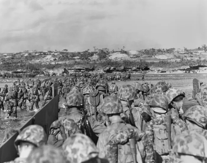 Framed Print : Marines leave their landing craft to wade over a coral reef to the Okinawa beach. The Japanese did not oppose the invasion, but waiting in fortified positions inland Framed Print : Marines leave their landing craft to wade over a coral reef to the Okinawa beach. The Japanese did not oppose the invasion, but waiting in fortified positions inland