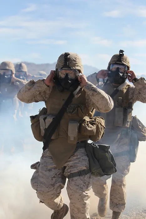Framed Print : US Marines and sailors in full protective gear marching through the cloud of gas to test with their new gear. Jan 26 2011. (BSLOC_2011_12_264)