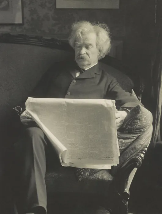 Framed Print : Mark Twain (aka Samuel Clemens), American writer and satirist, in photo by Charles E. Bolles. He is reading a newspaper dated, May 7, 1901 (BSLOC_2016_11_131)