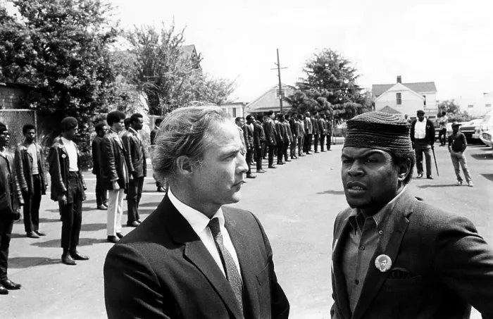 Framed Print : Marlon Brando talks with Black Panther Captain Kenny Denmon at the memorial services of a slain member of the group in Berkeley, California, 1968