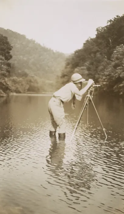 Framed Print : Marvin Breckinridge Patterson taking a photograph while standing in a river, 1935 Framed Print : Marvin Breckinridge Patterson taking a photograph while standing in a river, 1935