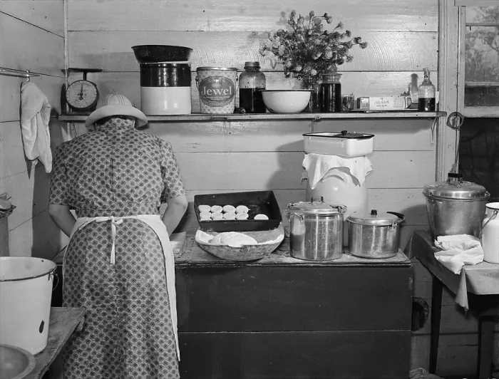 Framed Print : Mary Wilkins baking biscuits for dinner on cornshucking day near Tallyho, photograph by Marion Post Wolcott, North Carolina, September, 1939