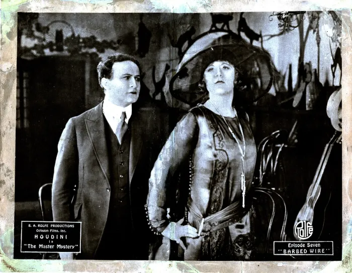 Framed Print : THE MASTER MYSTERY, from left, Harry Houdini, Edna Britton, episode seven, Barbed Wire, 1919