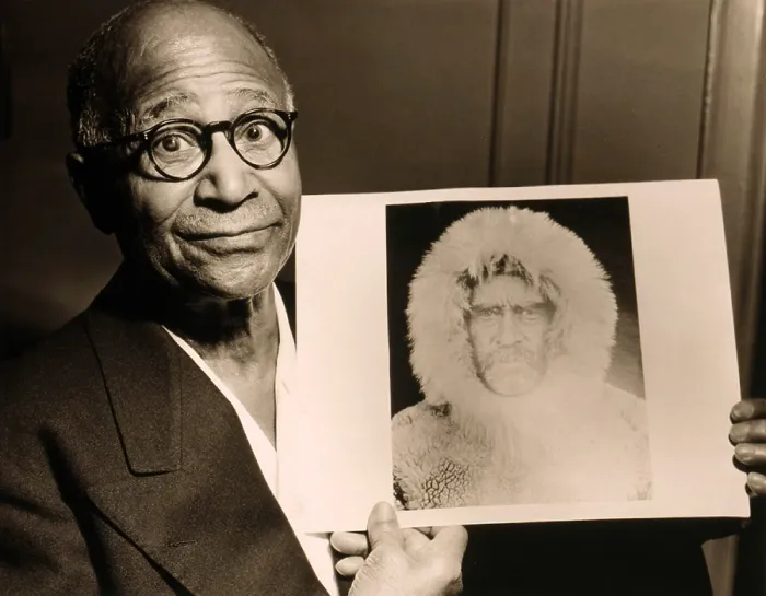 Framed Print : Matthew Henson (1866-1955), African American Arctic explorer, holding a portrait Admiral Robert E. Peary, his expedition leader. 1953