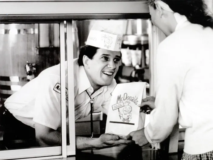Framed Print : McDonald's restaurant crew member at the window handing a customer a bag. 1950s. McDonald's Corp. photo. Photo by:Everett Collection(BSLOC_2011_6_180)