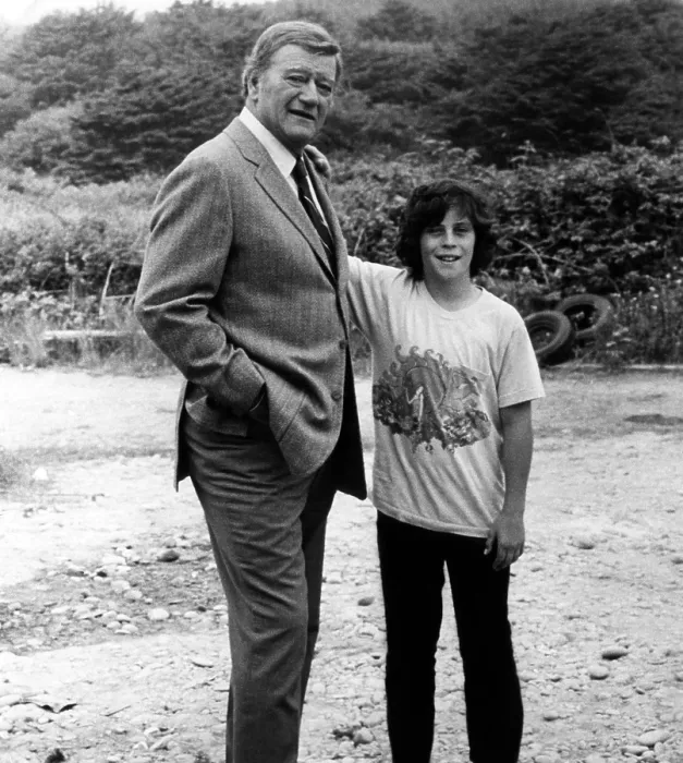Framed Print : MCQ, John Wayne (left), with his son John Ethan Wayne, on set, 1974.. Courtesy: CSU Archives  /  Everett Collection