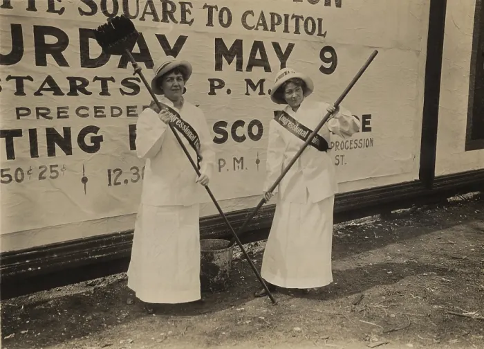 Framed Print : Two members of the Congressional Union for Woman Suffrage holding brushes in front of a large billboard advertisement for the procession to Congress on May 9th Framed Print : Two members of the Congressional Union for Woman Suffrage holding brushes in front of a large billboard advertisement for the procession to Congress on May 9th