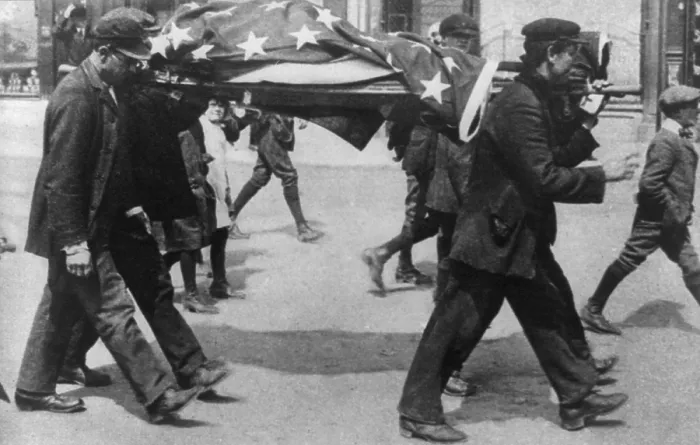 Framed Print : Men carrying flag draped body of American Lusitania victim. May 1915. (BSLOC_2012_4_108)