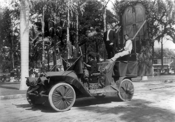 Framed Print : Three men, one dressed in cap and gown, on car with Yale University pennant used as float in a Hawaiian festival, title: Ubediah seeking knowledge on steps of Old Eli Framed Print : Three men, one dressed in cap and gown, on car with Yale University pennant used as float in a Hawaiian festival, title: Ubediah seeking knowledge on steps of Old Eli