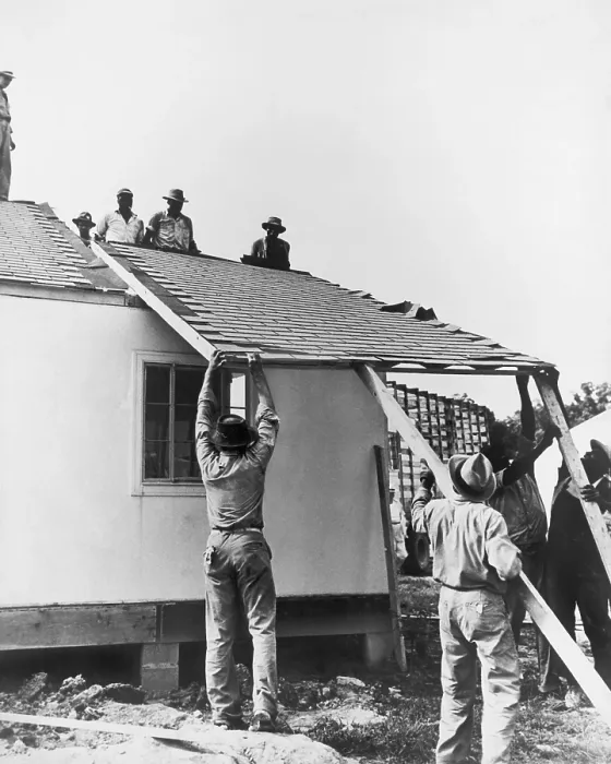 Framed Print : Men lifting a section of roof onto a prefabricated house, April 13, 1946. Construction materials developed for WW2 military, made their way into the general market in the 1940s Framed Print : Men lifting a section of roof onto a prefabricated house, April 13, 1946. Construction materials developed for WW2 military, made their way into the general market in the 1940s