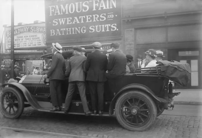 Framed Print : Men ride on the running boards of a improvised mass transit vehicle during a strike in Brooklyn, ca. 1915