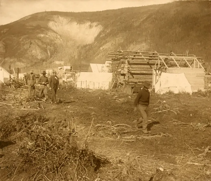 Framed Print : Men walking on Dawson City's Riverside Drive, in 1897 during the Yukon Gold Rush. The new street is lined with the town's first log and canvas structures