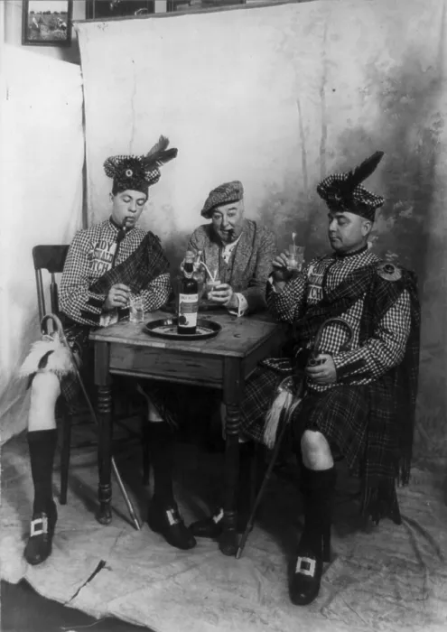Framed Print : Two men wearing kilts and man smoking cigar, seated at small table drinking Sandy MacDonald scotch, photograph, 1913 Framed Print : Two men wearing kilts and man smoking cigar, seated at small table drinking Sandy MacDonald scotch, photograph, 1913