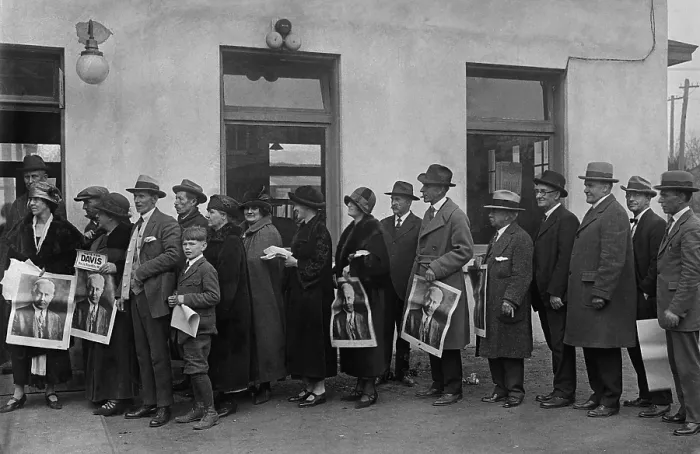 Framed Print : Men and women in line waiting to vote at Clarendon, Virginia, Nov. 4, 1924. Several people hold Posters for Democratic Presidential candidate, John Davis. (BSLOC_2015_16_191)