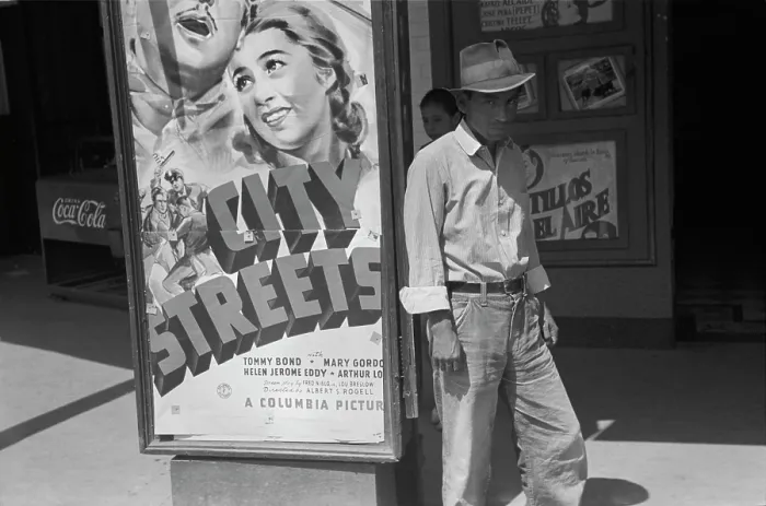 Framed Print : Mexican man in front of a movie theater playing CITY STREETS, San Antonio, Texas, photograph by Lee Russell, 1939
