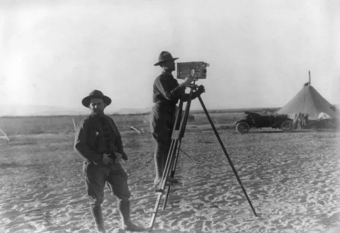 Framed Print : The Mexican War, Tracy Mathewson and William Fox, news photographers in camp with movie camera, photograph January 29, 1914