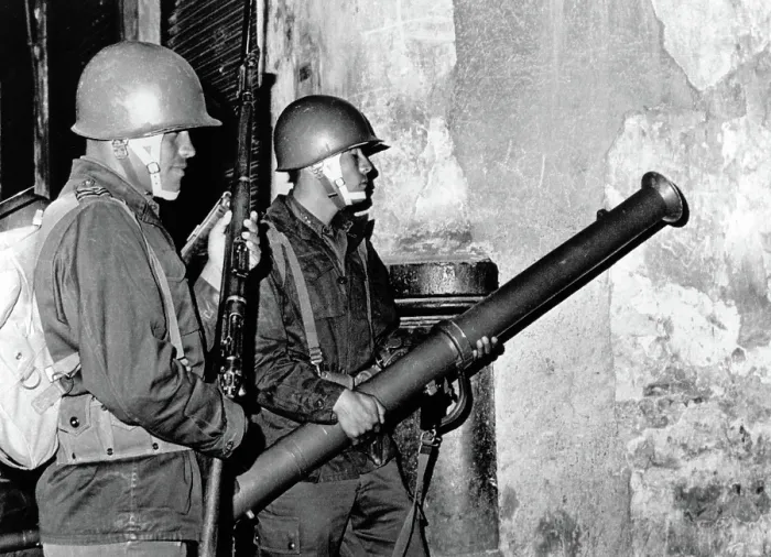 Framed Print : Mexico City: Mexican Army troops prepare to fire bazooka shell through a door of a student 'fortress.' Troops broke up student rioters