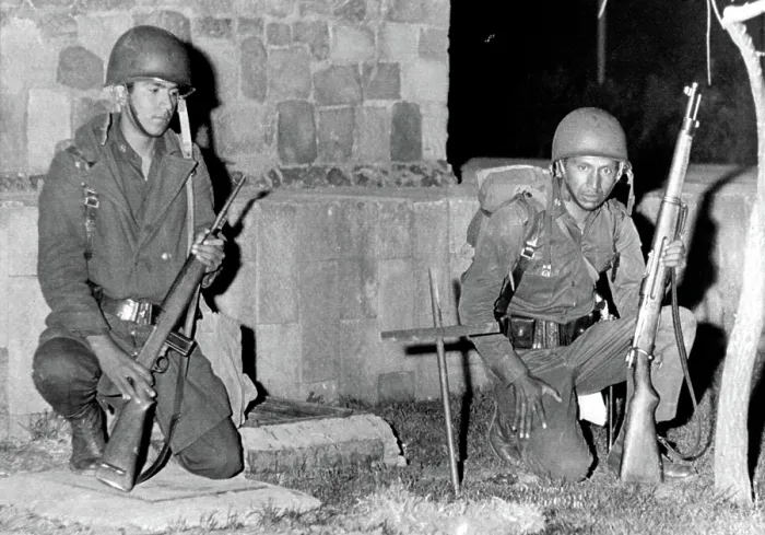 Framed Print : Mexico City: Mexican soldiers kneel by cross-marked site where an army trooper was killed by a sniper bullet during fighting with protesting students on October 3, 1968