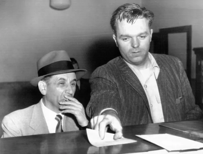 Framed Print : Meyer Lansky is booked on vagrancy charges at the West 54th Street police station in Manhattan