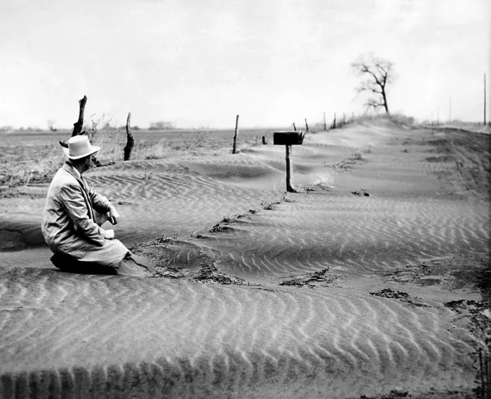 Framed Print : Mid-western farmer sitting in sand dunes along a country road. Sept. 1953. (CSU_ALPHA_1589) CSU Archives / Everett Collection