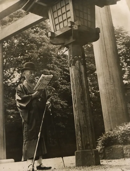 Framed Print : Mikimoto Kokichi, founder of the luxury pearl jewelry company, ca. 1930s. Mikimoto is dressed in a traditional Japanese kimono, reading his morning paper. (BSLOC_2013_9_87)