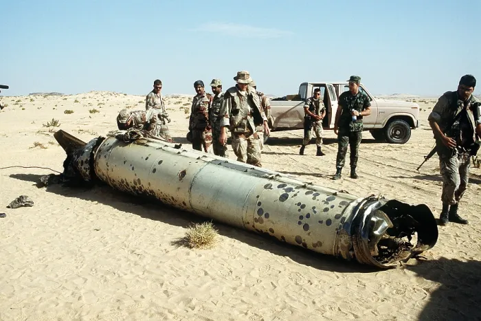 Framed Print : Military personnel examine a Scud missile shot down by an Patriot air defense missile during Operation Desert Storm. May 26 1992. (BSLOC_2011_3_36)
