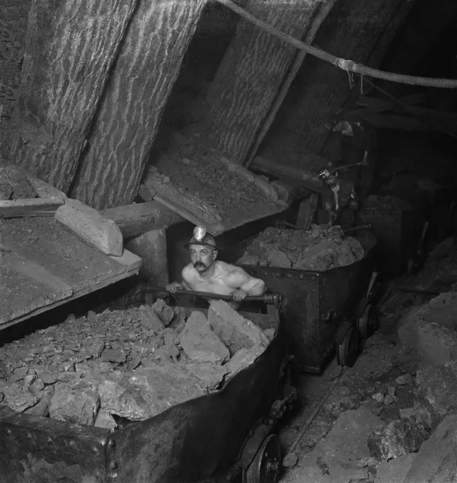 Framed Print : A miner working a mine underground, loading and handling cars with copper ore, Calumet-Hecla Mines, Calumet, Michigan. Ca. 1915 Framed Print : A miner working a mine underground, loading and handling cars with copper ore, Calumet-Hecla Mines, Calumet, Michigan. Ca. 1915