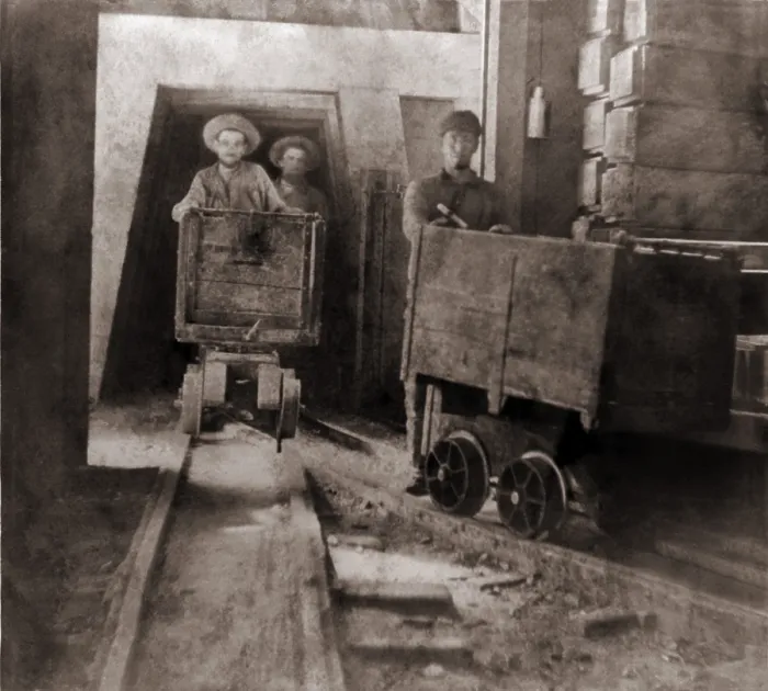 Framed Print : Miners pushing ore carts through the tunnels of the Gould & Curry Mine in Virginia City, Nevada