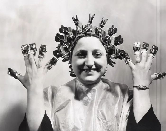 Framed Print : Model wears Helene Curtis remote control permanent wave. March 13, 1940. She wears nail shields invented by David of Wilshire to protect her freshly polished nails