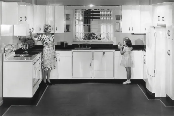 Framed Print : Modern electric kitchen with a stove and refrigerator. An electric dishwasher is to right of the sink. The all metal cabinets complete advanced design. Ca. 1950 Framed Print : Modern electric kitchen with a stove and refrigerator. An electric dishwasher is to right of the sink. The all metal cabinets complete advanced design. Ca. 1950