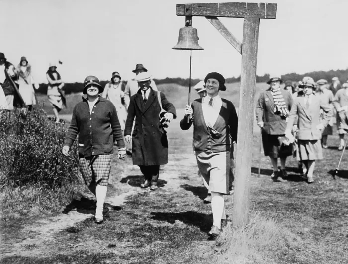 Framed Print : Molly Gourlay, ex-British women's open champion, at the Formby Ladies Golf Club. She rings the 7th tee all clear bell with her golf club, ca. 1930. (BSLOC_2013_9_23)
