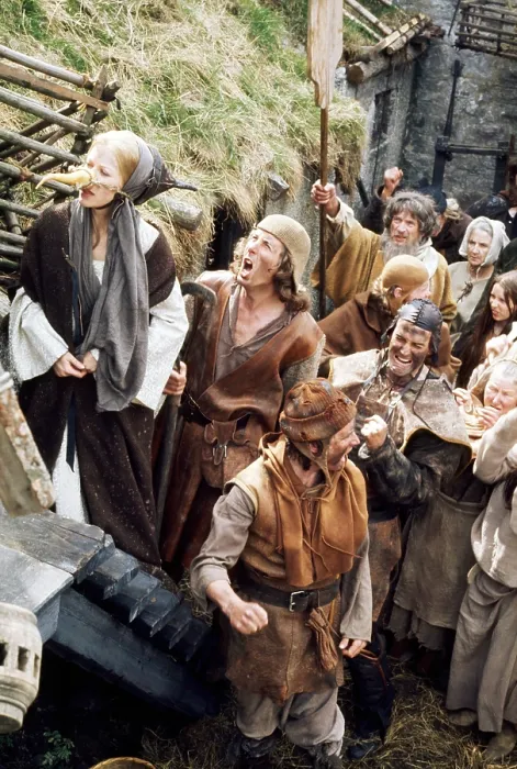 Framed Print : MONTY PYTHON AND THE HOLY GRAIL, Connie Booth (carrot nose), Eric Idle (second from left, yelling), Michael Palin (dirty, torn watchcap), John Cleese (dark leather cap)