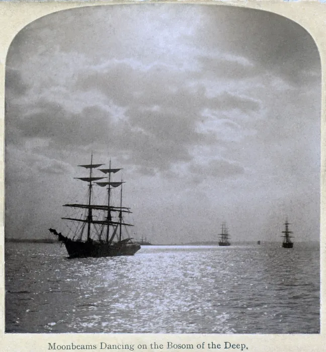 Framed Print : Moonbeams dancing on the bosom of the deep'. Stereograph showing moonlight on water, and sailing ships at anchor, ca. 1895