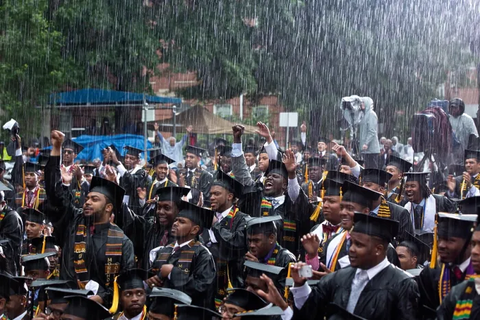 Framed Print : Morehouse College graduates cheer President Barack Obama (off camera) at their commencement ceremony. Atlanta, Ga. May 19, 2013, during pouring rain. (BSLOC_2015_3_80)
