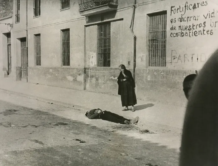 Framed Print : A mother looks on the body of her son in a street of Castillon, Spain. Aug. 8, 1938. It is not known for which side this man fought. Spanish Civil War, July 1936-March 1939