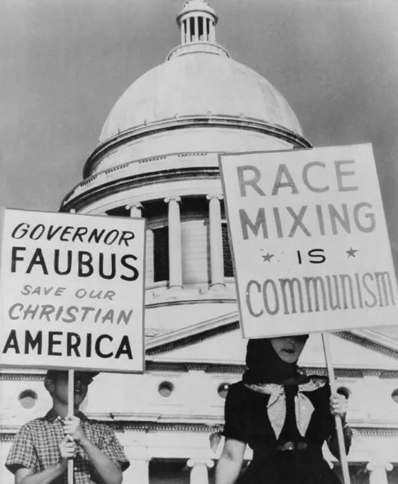 Framed Print : A mother and her son hold signs equating school integration with communism and segregation with Christianity. At the Arkansas state capitol in Little Rock. 1959 Framed Print : A mother and her son hold signs equating school integration with communism and segregation with Christianity. At the Arkansas state capitol in Little Rock. 1959