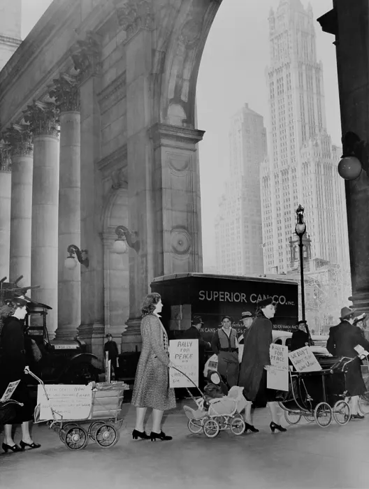 Framed Print : Mothers protest to keep America out of war, Nov. 8, 1939. Women with baby carriages marching for peace in New York City, with the Woolworth Building in the background Framed Print : Mothers protest to keep America out of war, Nov. 8, 1939. Women with baby carriages marching for peace in New York City, with the Woolworth Building in the background