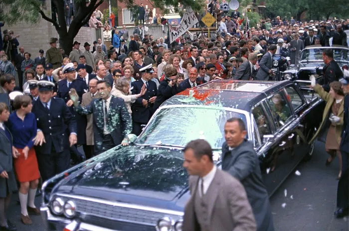 Framed Print : Motorcade of President Lyndon Johnson attacked by anti-Vietnam War protesters in Melbourne, Australia. Protesters threw paint on the car, police and Secret Service agents on Oct